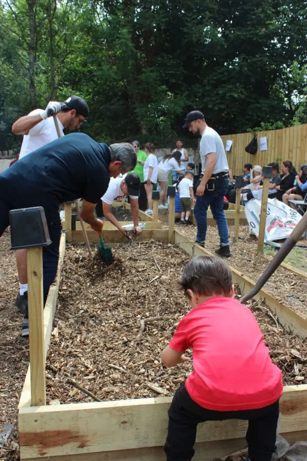 Families working together on a new garden bed